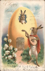 A Happy Easter - Rabbit inside an egg house being serenaded by another rabbit with guitar Postcard