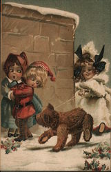 Kids playing in the snow with a bear Postcard
