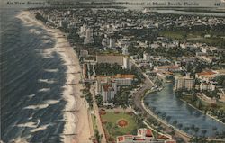 Air view showing hotels along Ocean Front and Lake Pancoast at Miami Beach, Florida Postcard