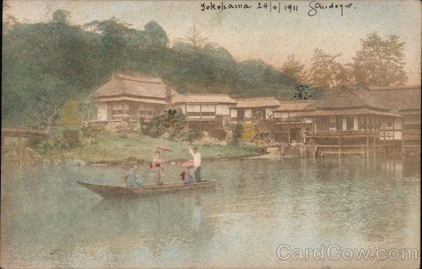 Japanese Family in Traditional Attire on Boat with houses on the shore Yokohama