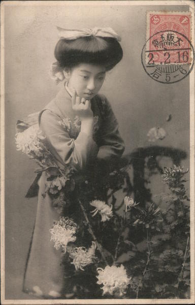 Woman in Traditional Japanese Attire Looking at Flowers Osaka