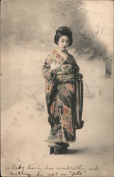 A lady having her umbrella and putting her feet on "geta" Postcard