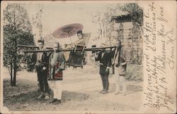 Woman in Traditional Japanese Attire Sitting in Sedan Chair with Umbrella Postcard