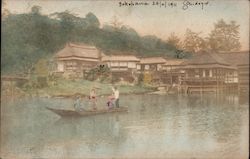 Japanese Family in Traditional Attire on Boat with houses on the shore Postcard