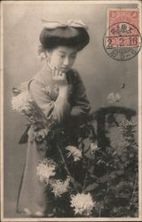 Woman in Traditional Japanese Attire Looking at Flowers Postcard
