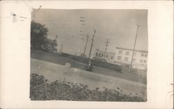 Man other side of wall on roadway, buildings Bucyrus, OH Postcard Postcard Postcard