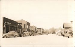 Main Street view, LGA Stores, business district, cars Bangor, MI Postcard Postcard Postcard