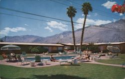 Place in the sun. Pool, mountain view, palm trees Postcard