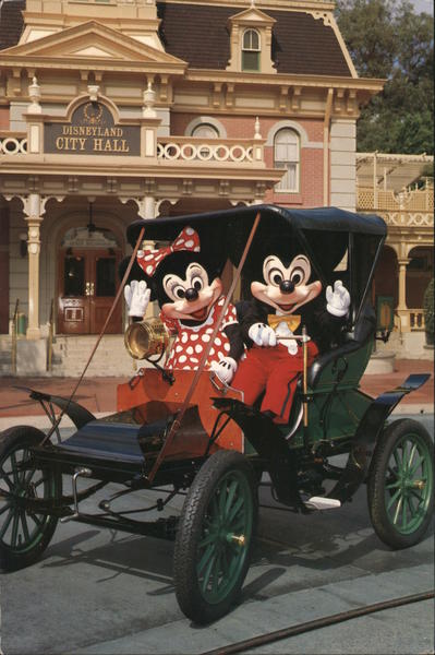 Touring Town Square. Mickey and Minnie Mouse driving a Model T. Anaheim California