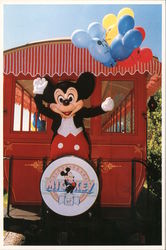 60 Years of Mickey. Mickey standing on back of Red Trolley waving and holding balloons Postcard