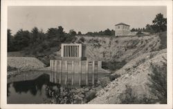 Building on pylons in lake, Dam Postcard