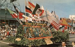 Flags of California float in parade. Fiesta Time Postcard
