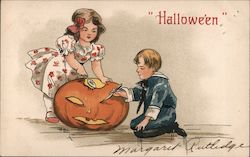 Halloween. Children carving a pumpkin. Postcard