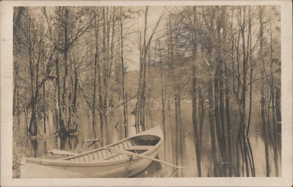 Canoe Sits Alone on a Lake Canoes & Rowboats