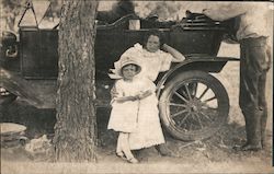 Family with old Touring Car Postcard