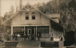 Men standing in front of farmhouse Postcard
