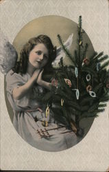 Young lady with angel wings and artificial xmas tree Postcard