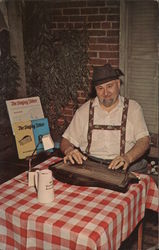 Mr. Willie Ditrich plays a zither, an instrument popular in old Germany. Postcard