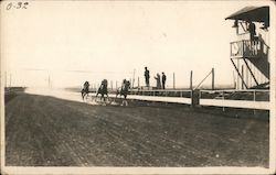 Three Horses With Jockeys Running on a Track Postcard