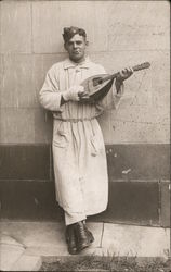Man With Sitar or Mandolin Postcard