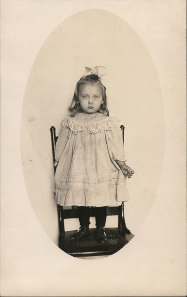 Little Girl Standing on a Chair - Sad Face Children