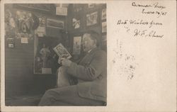 Man Reading a book Postcard