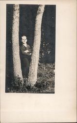 Man between trees Phillips, WI Men Postcard Postcard Postcard