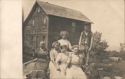 Family outside house Postcard