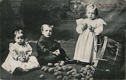 Three babies and a basket of potatoes Postcard