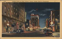 Looking South on Stone Avenue, Pioneer Hotel in Foreground Postcard