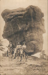 Two Men and a Woman on Donkeys Postcard