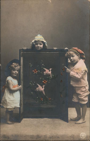 Children Posing with Bird Painting