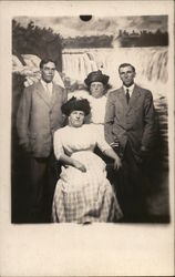 Studio Family Photograph with Niagara Falls Background Postcard