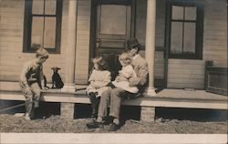 Family on Porch with Puppy Postcard