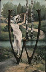 Woman Standing by the Letter W Made Out of Tree Trunks Postcard