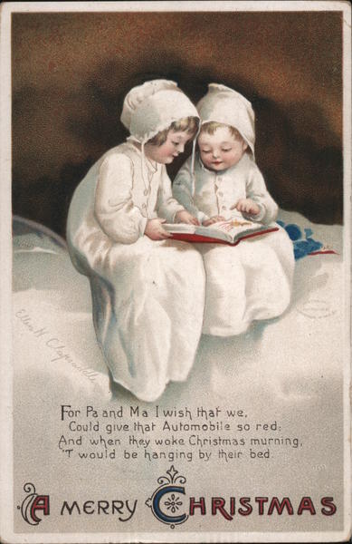 A Merry Christmas - Two Children Reading a Book in Bed