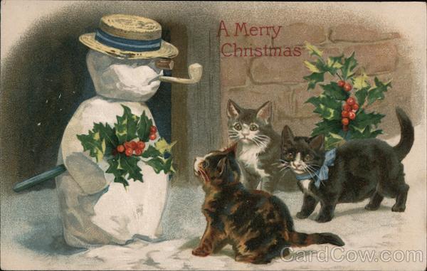 A Merry Christmas - three kittens looking at snowman