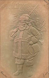 A Merry Christmas - Santa holding a tree and toys Postcard