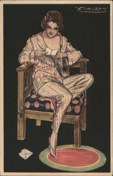 Beautiful woman in pajamas in a chair, reading a letter or card Postcard