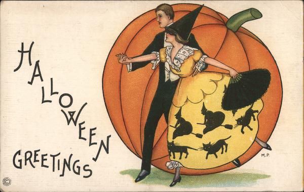 Halloween Greetings-A adult couple dancing in front of a pumpkin