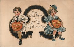 May You Have A Jolly Halloween - Girl and Boy Holding Jack-O-Lanterns Postcard