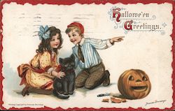 Girl and boy kneeling by a black cat with a jack-o-latern Postcard