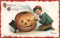 Boy Putting Candle in Jack O'Lantern: Halloween Greetings Postcard
