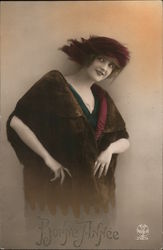 A woman wearing a burgundy feather hat and a fur jacket Postcard