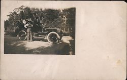 People in a Car and a Man Standing in Front of a Car Postcard