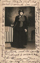 Woman Standing Next to a Flag Statue Postcard