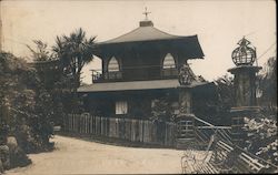 Building with Benches and Fence in Front Postcard