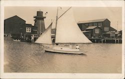 Person on a Sailboat near the Docks Postcard
