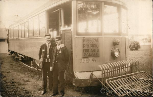 Two Men Standing By a Cable Car, Muni San Francisco California