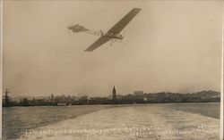 1911 Hubert Latham Flying Over The Bay in this "Antionette" Postcard